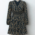 Dress with small beige flowers, featuring ruffles and gathers.