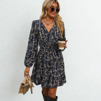 Dress with small beige flowers, featuring ruffles and gathers.