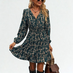 Dress with small beige flowers, featuring ruffles and gathers.