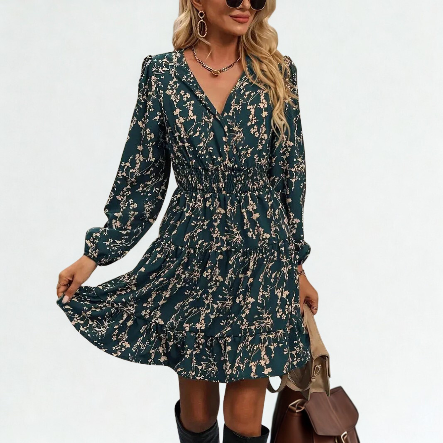 Dress with small beige flowers, featuring ruffles and gathers.