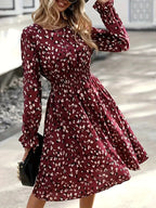 Midi flared dress in burgundy print with gathered waist